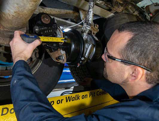 mechanic working on brakes