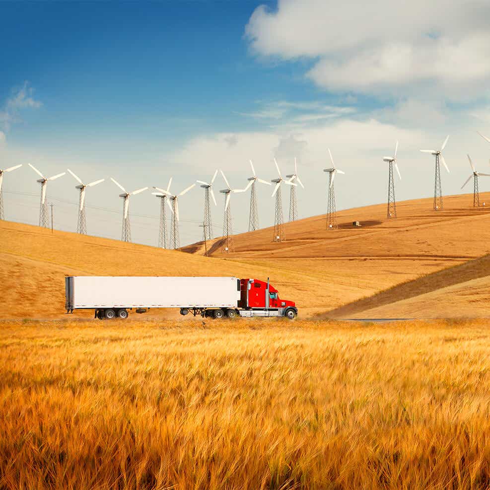 truck driving in the middle of agricultural fields