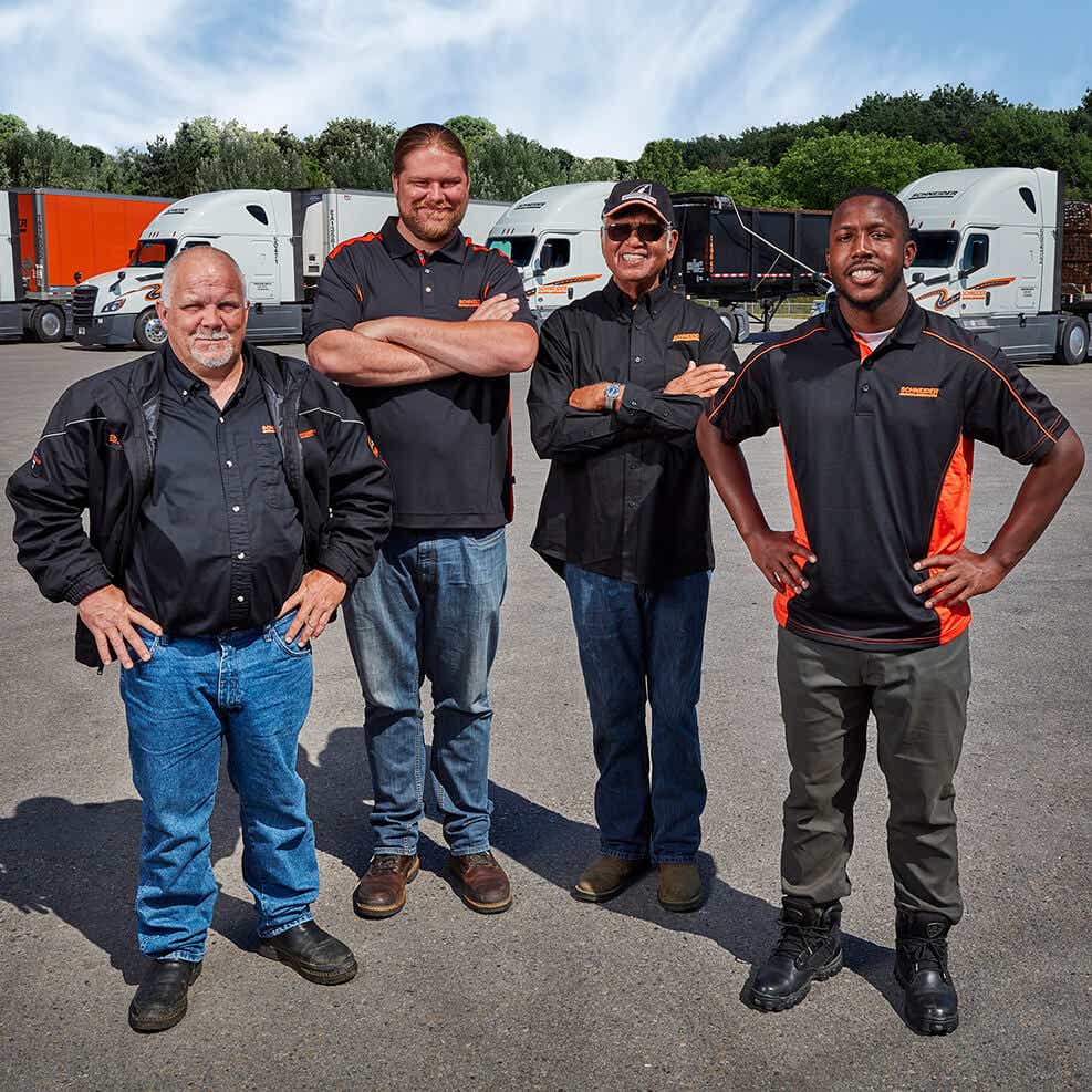 private fleet drivers standing in front of equipment