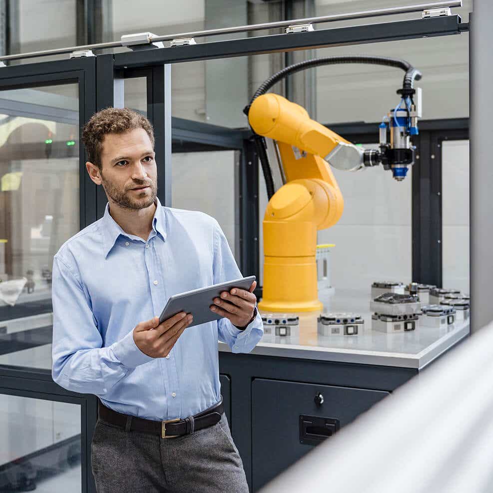 man in manufacturing on tablet determining shipping