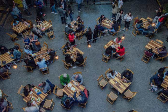 people eating outside at a restaurant