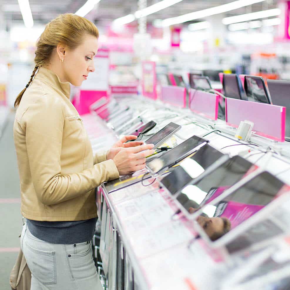 woman looking at tablet devices